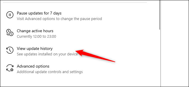 A red arrow pointing to the Update History option in the Settings app