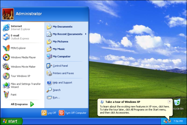 The Start menu on a Windows XP desktop with the green field and sky background. 