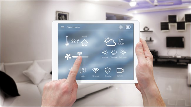 Hands using a Smart Home Automation on an iPad.
