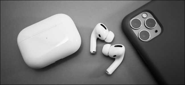 AirPods Pro next to an iPhone 11 Pro.