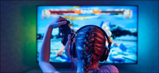A girl playing video games on a television.